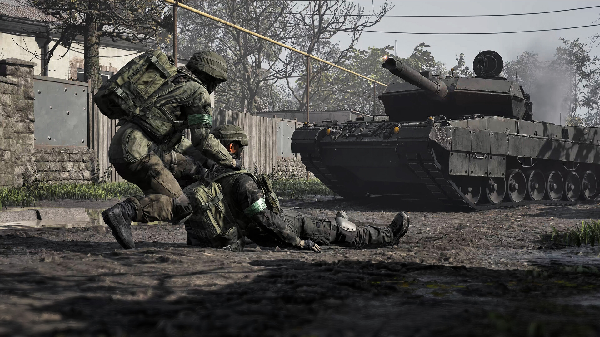 Soldiers dragging a wounded comrade to cover as a camouflaged tank advances down a muddy street in WARDOGS